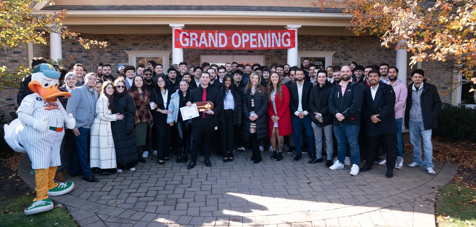 The Lexington team gathered at a community grand opening event