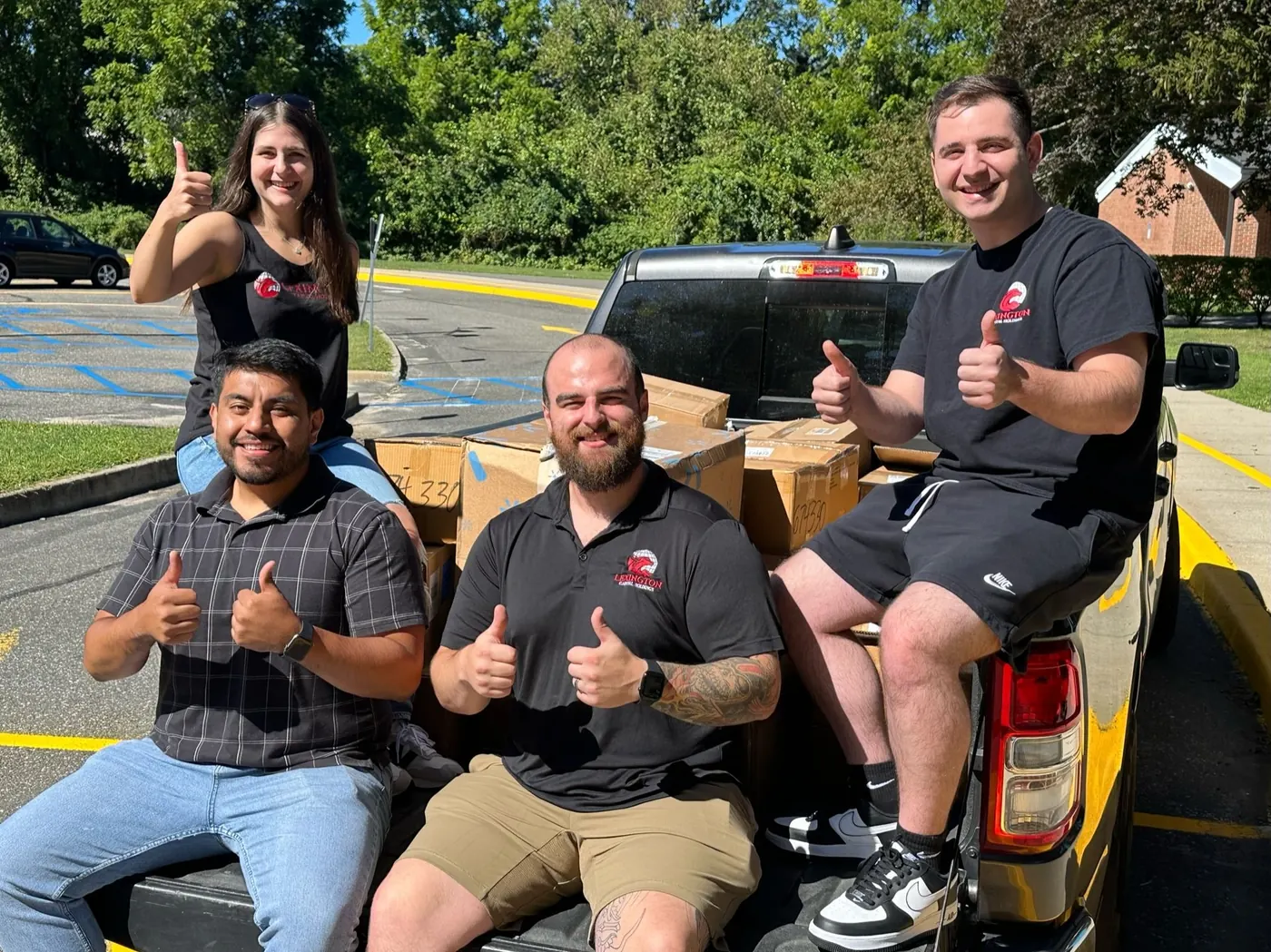 Team members giving thumbs up at a Lexington Foundation drive