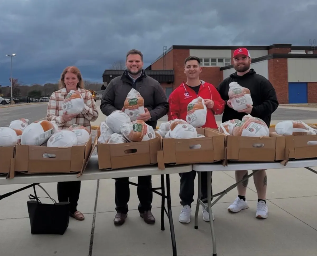 Lexington team members at a turkey giveaway table